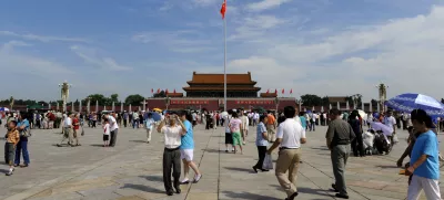 Visitors gather in Tiananmen Square in Beijing, Friday, Aug. 15, 2008. Pollution concerns evaporated Friday under a picture-perfect canopy of blue skies and white clouds on the first day of the Olympic Games' signature track-and-field events. (AP Photo/Oliver Multhaup)
