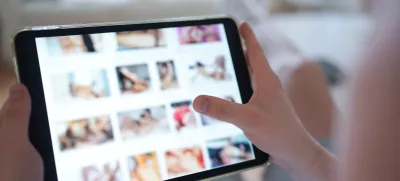 FILED - 14 April 2025, Hamburg: A young person looks at a porn website on a smartphone. Aylo, the company behind Pornhub, Redtube and Youporn, plans to block content from the afternoon onwards in protest at new French age verification regulations, local media reports said on Tuesday. Photo: Marcus Brandt/dpa