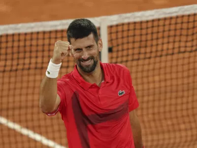 Serbia's Novak Djokovic celebrates as he won the quarterfinal match of the French Tennis Open against Germany's Alexander Zverev at the Roland-Garros stadium in Paris, Wednesday, June 4, 2025. (AP Photo/Aurelien Morissard)