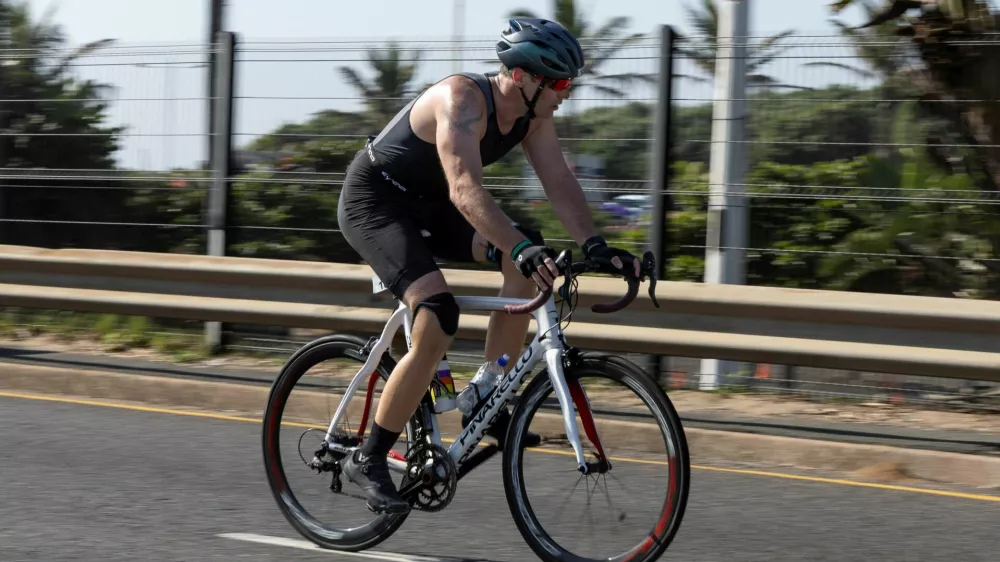 South African former Paralympic athlete Oscar Pistorius competes in a triathlon event, 12 years after murdering his girlfriend and a year after his release on parole, in the coastal city of Durban, South Africa, June 1, 2025. REUTERS/Michael Fragoeiro