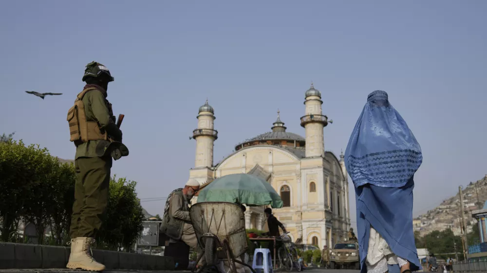 A Taliban fighter stands guard near the Shah-Do Shamshira Mosque as people attend the Eid al-Adha prayer in Kabul, Afghanistan, Saturday, June 7, 2025. (AP Photo/Ebrahim Noroozi)
