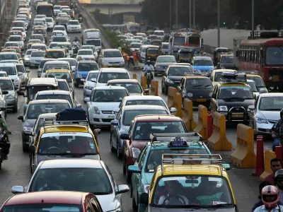 ﻿Traffic clogs a road in Mumbai, India, Friday, Dec. 5, 2014. India says it is taking bold steps against climate change with plans for a five-fold increase in renewable energy capacity. However, Environment Minister Prakash Javadekar said the country won't act to curb carbon emissions because it first must pursue economic growth to eradicate poverty. (AP Photo/Rajanish Kakade)
