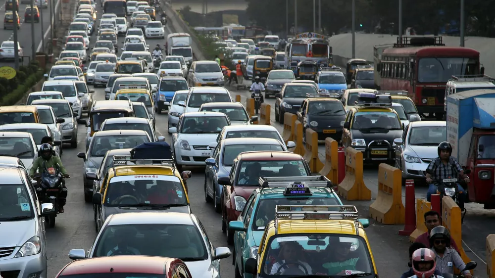 ﻿Traffic clogs a road in Mumbai, India, Friday, Dec. 5, 2014. India says it is taking bold steps against climate change with plans for a five-fold increase in renewable energy capacity. However, Environment Minister Prakash Javadekar said the country won't act to curb carbon emissions because it first must pursue economic growth to eradicate poverty. (AP Photo/Rajanish Kakade)