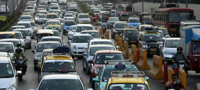 ﻿Traffic clogs a road in Mumbai, India, Friday, Dec. 5, 2014. India says it is taking bold steps against climate change with plans for a five-fold increase in renewable energy capacity. However, Environment Minister Prakash Javadekar said the country won't act to curb carbon emissions because it first must pursue economic growth to eradicate poverty. (AP Photo/Rajanish Kakade)