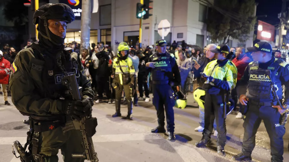 Police stand guard outside the Medicentro hospital where Colombian senator and presidential candidate Miguel Uribe Turbay is being treated after he was shot during a campaign rally in Bogota, Colombia, Saturday, June 7, 2025. (AP Photo/Jhon Wilson Vizcaino)