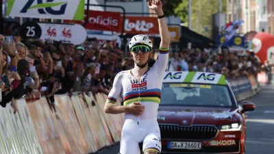 Slovenia's Tadej Pogacar of the UAE Team Emirates URG team crosses the finish line to win the Belgian cycling classic and UCI World Tour race Liege Bastogne Liege, in Liege, Belgium, Sunday, April 27, 2025. (AP Photo/Geert Vanden Wijngaert)