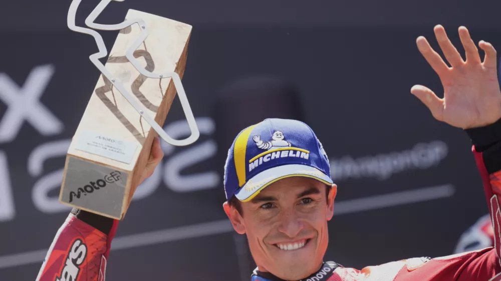 Race winner Spain's rider Marc Marquez of the Ducati Lenovo Team celebrates on the podium after the MotoGP race of the Grand Prix of Aragon at the MotorLand Aragon circuit, in Alcaniz, Spain, Sunday, June 8, 2025. (AP Photo/Jose Breton)