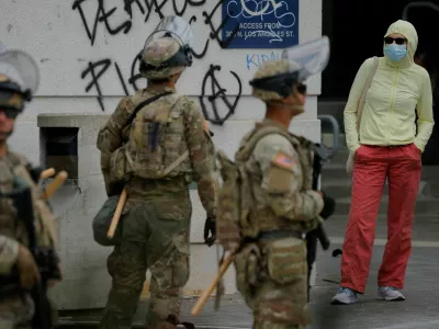 Members of the California National Guard stand outside the Edward R. Roybal federal building after their deployment by U.S. President Donald Trump, in response to protests against immigration sweeps, in Los Angeles, California, U.S. June 8, 2025. REUTERS/Mike Blake