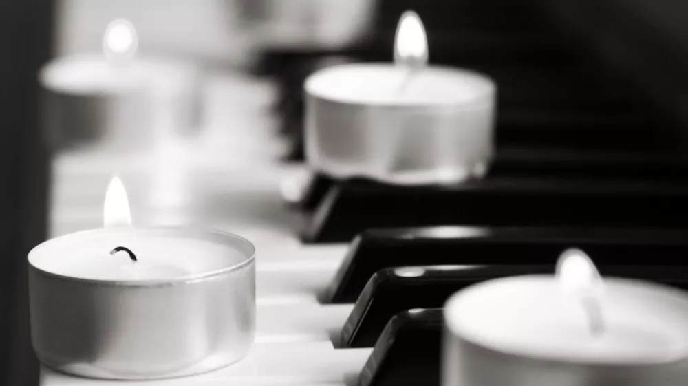 burning candles and pianoforte, monochrome image