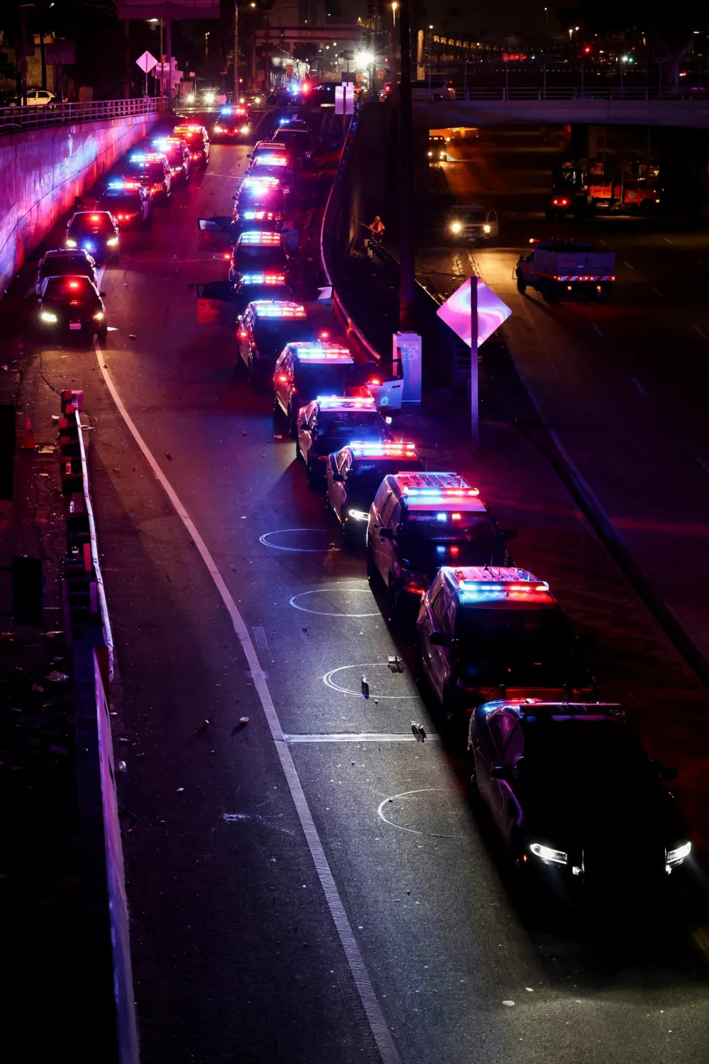 Police vehicles line up during a protest against federal immigration sweeps in downtown Los Angeles, California, U.S. June 8, 2025. REUTERS/Aude Guerrucci