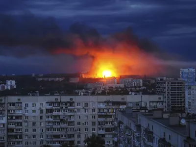 Fire and smoke rise from the site where a Russian missile struck a residential area in Kharkiv, Ukraine, Saturday, June 7, 2025, (AP Photo/Anatolii Lysianskyi)