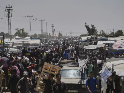Palestinians heading to receive food and humanitarian aid packages from the Gaza Humanitarian Foundation, a U.S.-backed organization, in Rafah, southern Gaza Strip, Monday, June 9, 2025. (AP Photo/Abdel Kareem Hana)