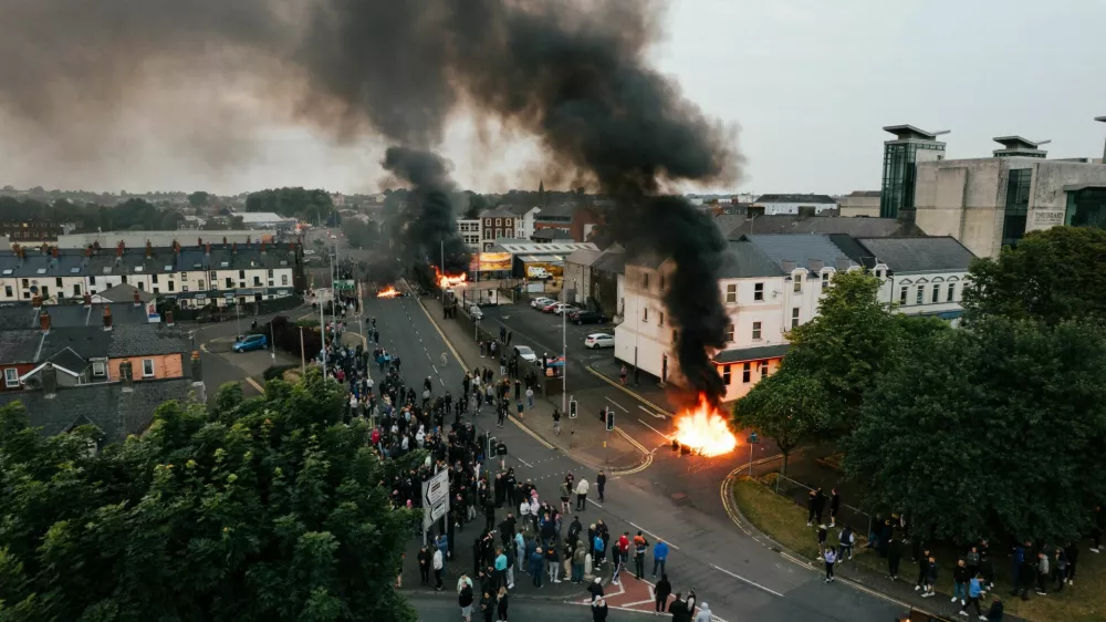 Drone view of smoke and fire rising amid riots in Ballymena, Northern Ireland June 10, 2025 in this picture obtained from social media. @laganphoto via Instagram/via REUTERS THIS IMAGE HAS BEEN SUPPLIED BY A THIRD PARTY. MANDATORY CREDIT.