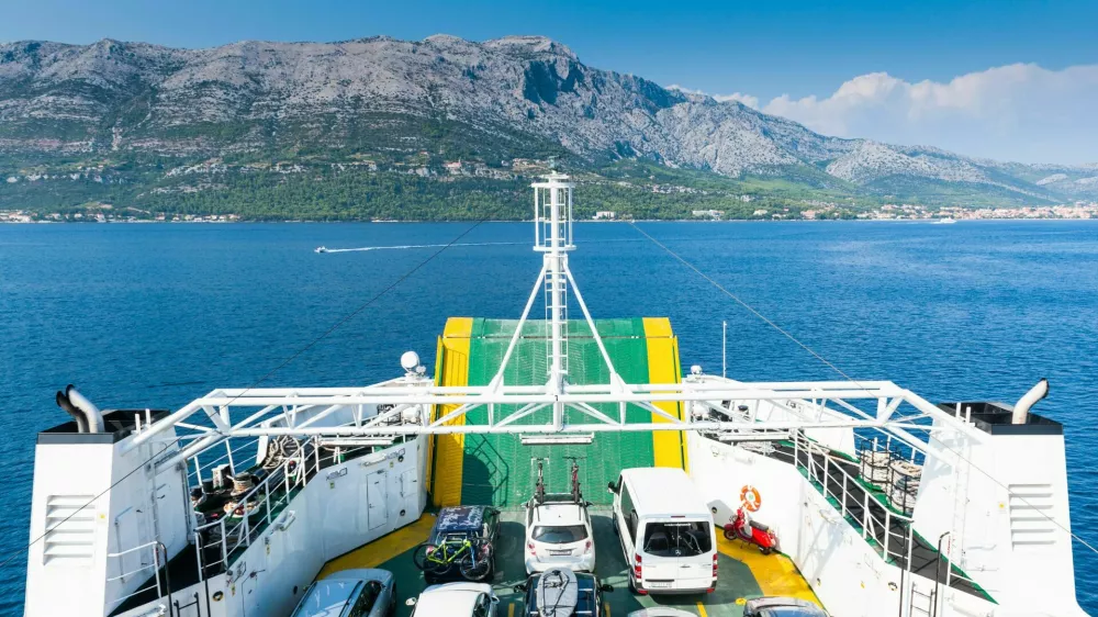FB8T56 Cars on the ferry from the mainland Peljesac Peninsula to the Island of Korcula, Croatia, Europe.