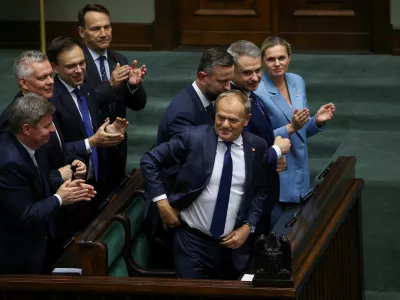 Polish Minister of Foreign Affairs Radoslaw Sikorski, Deputy Prime Minister and Minister of National Defence Wladyslaw Kosiniak-Kamysz, Minister of Education Barbara Nowacka and Prime Minister Donald Tusk react after a vote of confidence for Tusk's center-left coalition government, in Warsaw, Poland, June 11, 2025. REUTERS/Kacper Pempel