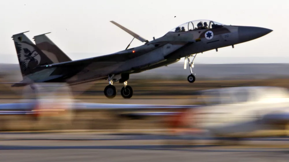 ** FILE ** In this Thursday, Dec. 27, 2007 photo, an Israeli Air Force fighter plane lands during an acrobatics display at a graduation ceremony at the Hatzerim Air Force Base near the southern Israeli city of Beersheba. Israel appears increasingly confident that it would be able to deal a sharp setback to Iran's nuclear program, if not destroy it, through a military strike. (AP Photo/Kevin Frayer, File)