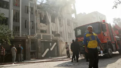 Rescuers work at the scene of a damaged building in the aftermath of Israeli strikes, in Tehran, Iran, June 13, 2025. Majid Asgaripour/WANA (West Asia News Agency) via REUTERS  ATTENTION EDITORS - THIS PICTURE WAS PROVIDED BY A THIRD PARTY