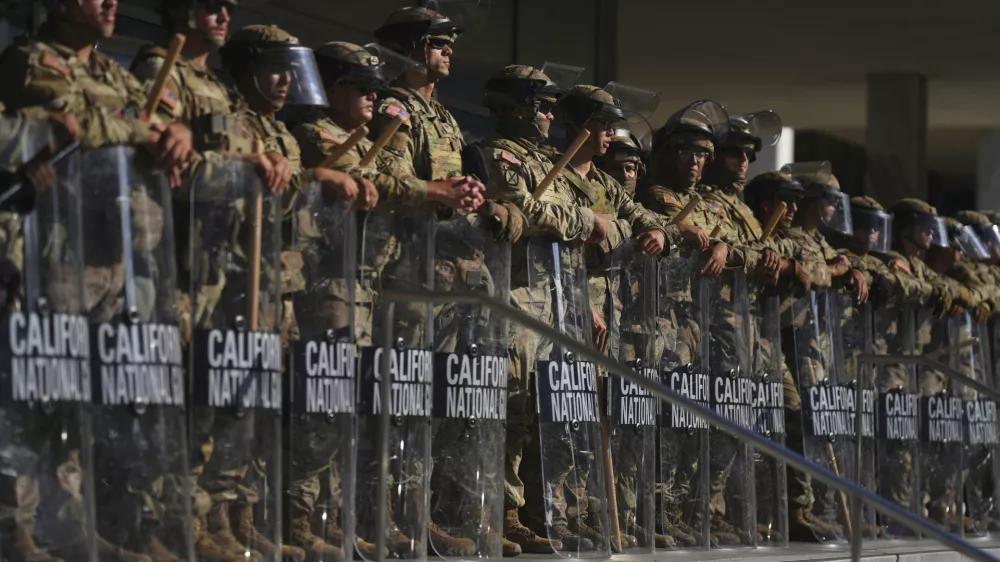 California National Guard are positioned at the Federal Building on Tuesday, June 10, 2025, in downtown Los Angeles. (AP Photo/Eric Thayer)