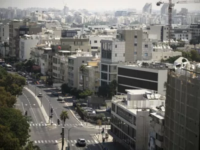 A general view shows the mostly empty streets near Tel Aviv's beachfront, Friday, June 13, 2025. (AP Photo/Leo Correa)