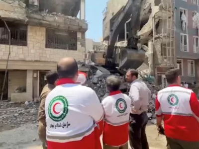 Rescuers work at the site of a damaged building, in the aftermath of Israeli strikes, in location given as Tehran, Iran, in this screen grab from a handout video released on June 14, 2025. Iranian Red Crescent Society/Handout via REUTERS ATTENTION EDITORS - THIS PICTURE WAS PROVIDED BY A THIRD PARTY. NO RESALES. NO ARCHIVES. MANDATORY CREDIT
