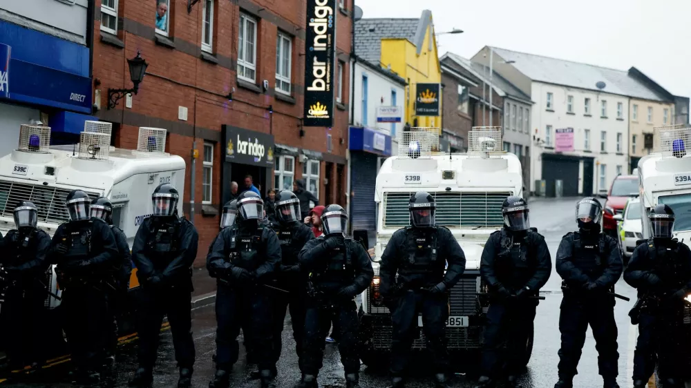 Police block a road during the fourth evening of unrest, following a protest over an alleged sexual assault in Ballymena on a teenage girl, in Portadown, Northern Ireland, June 12, 2025. REUTERS/Clodagh Kilcoyne. REFILE - CORRECTING SUBJECT LOCATION FROM "LOCAL" TO "IN BALLYMENA".