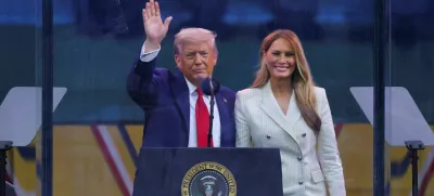 U.S. President Donald Trump waves next to first lady Melania Trump following the military parade to commemorate the U.S. Army's 250th Birthday, on the day of U.S. President Donald Trump 79th birthday, in Washington, D.C., U.S., June 14, 2025. REUTERS/Carlos Barria