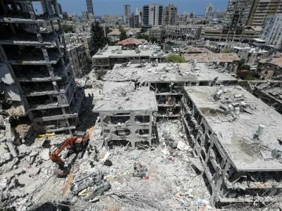 Damaged buildings are seen following a missile attack from Iran on Israel, in Bat Yam, Israel, June 15, 2025. REUTERS/Ronen Zvulun    TPX IMAGES OF THE DAY