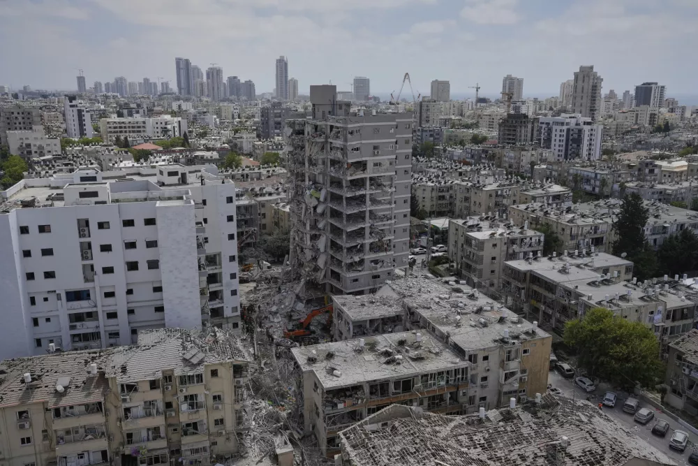 A view of residential buildings destroyed by an Iranian missile strike in Bat Yam, central Israel, on Sunday, June 15, 2025. (AP Photo/Baz Ratner)