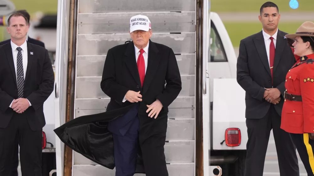 President Donald Trump arrives on Air Force One at Calgary International Airport, Sunday, June 15, 2025, in Calgary, Canada, ahead of the G7 Summit. (AP Photo/Gerald Herbert)