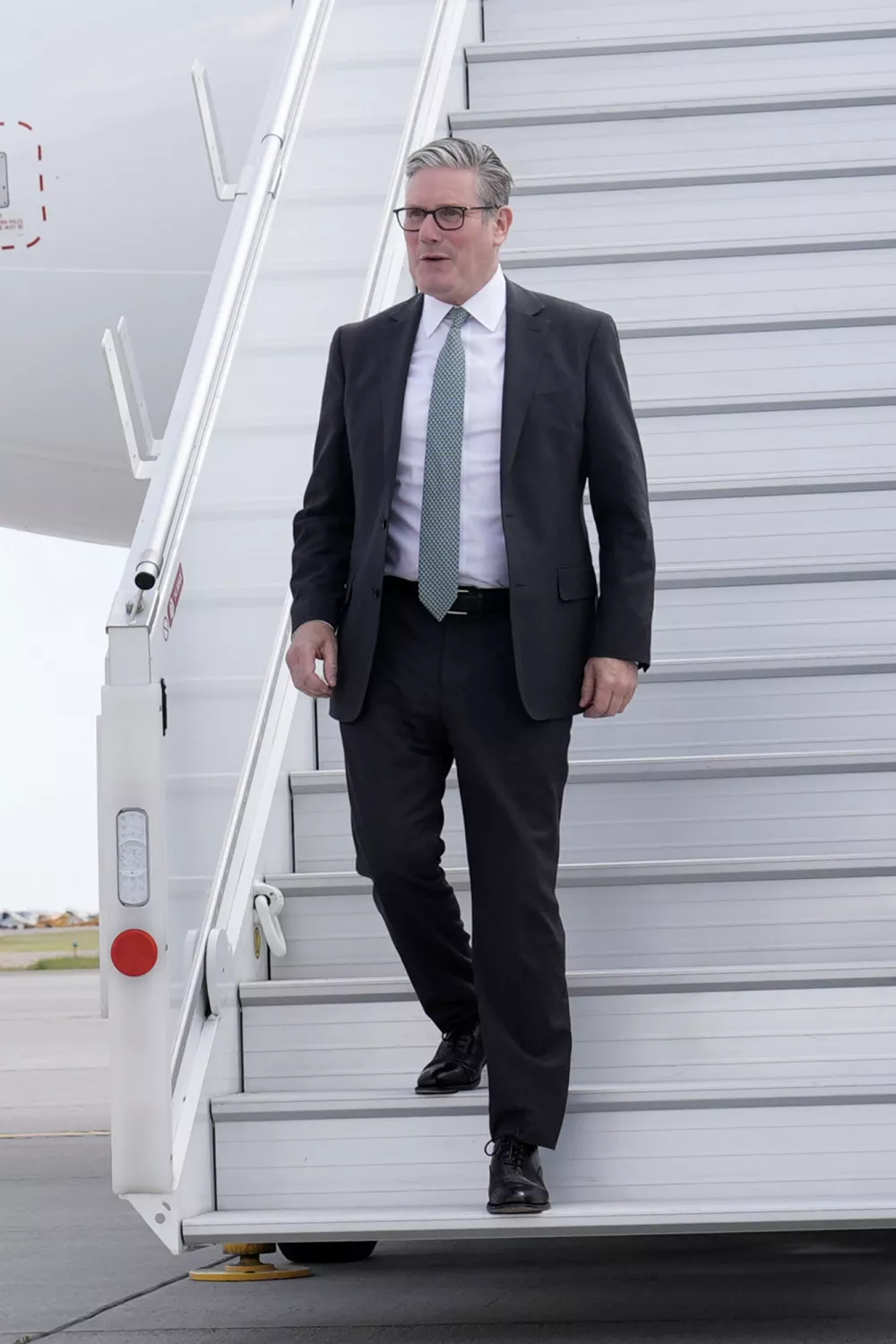 Britain's Prime Minister Keir Starmer arrives at at Calgary International Airport, in Calgary, Alberta, ahead of the G7 summit leaders' meeting, Sunday, June 15, 2025. (Stefan Rousseau/Pool Photo via AP)