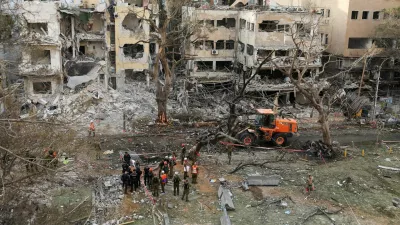 Emergency personnel work at an impact site after missiles were launched from Iran to Israel, in Tel Aviv, Israel, June 16, 2025. REUTERS/Ronen Zvulun   TPX IMAGES OF THE DAY