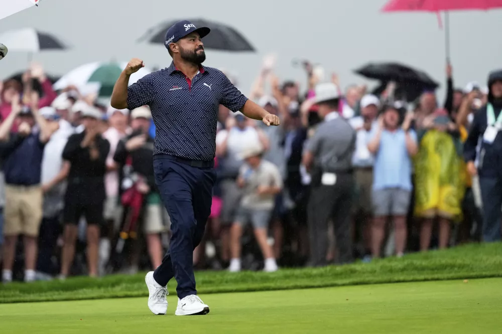 J.J. Spaun celebrates after winning the U.S. Open golf tournament at Oakmont Country Club Sunday, June 15, 2025, in Oakmont, Pa. (AP Photo/Carolyn Kaster)