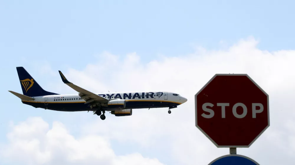 ﻿A Ryanair airplane passes a Stop sign as it lands at Barcelona-El Prat airport, the day before a cabin crew strike is to be held in European countries, in Barcelona, Spain, July 24, 2018. REUTERS/Albert Gea