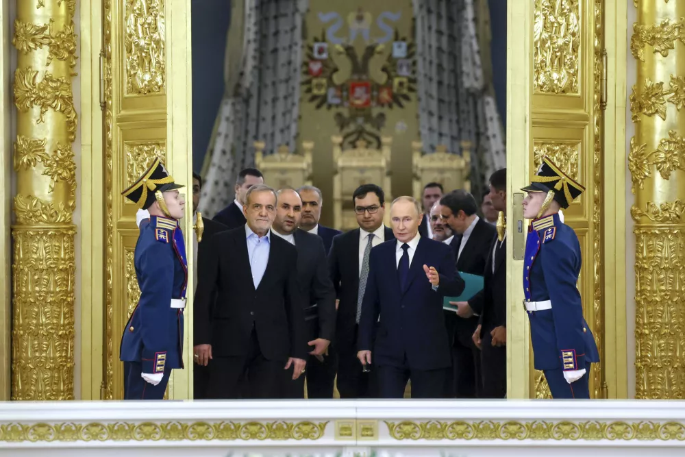 FILE - Iranian President Masoud Pezeshkian, center left, and Russian President Vladimir Putin, center right, arrive for a signing ceremony following talks at the Kremlin in Moscow, Russia, on Friday, Jan. 17, 2025. (Vyacheslav Prokofyev, Sputnik, Kremlin Pool Photo via AP, File)