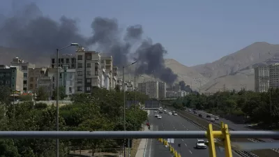 Smoke rises from an oil storage facility after it appeared to have been struck by an Israeli strike on Saturday, in Tehran, Iran, Monday, June 16, 2025. (AP Photo/Vahid Salemi)