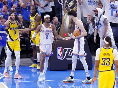 Jun 16, 2025; Oklahoma City, Oklahoma, USA; Oklahoma City Thunder guard Shai Gilgeous-Alexander (2) and forward Chet Holmgren (7) celebrate during the fourth quarter against the Indiana Pacers in game five of the 2025 NBA Finals at Paycom Center. Mandatory Credit: Alonzo Adams-Imagn Images