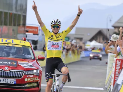 14 June 2025, France, Mont-Cenis: Slovenian cyclist Tadej Pogacar of UAE Team Emirates XRG celebrates winning the 8th and final stage of the 77th edition of the Criterium du Dauphine cycling race, 133.3 km from Val-d'Arc-Val-Cenis to Plateau du Mont Cenis. Photo: Stefano Cavasino/LiveMedia-IPA/ZUMA Press Wire/dpa