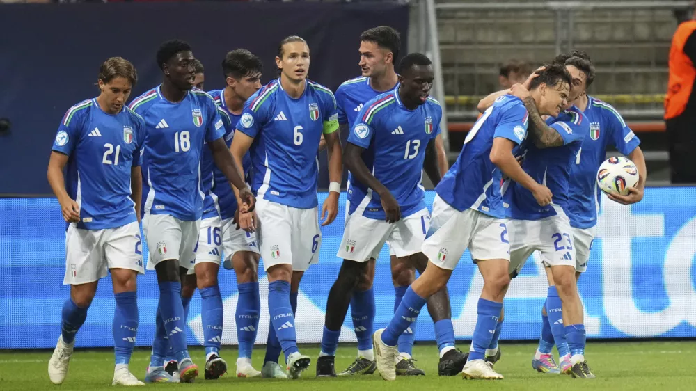Italian players celebrate after scoring during the group A European U-20 Championship soccer match between Spain and Italy in Trnava, Slovakia, Tuesday, June 17, 2025. (AP Photo/Petr David Josek)