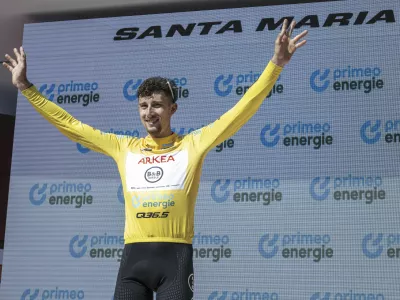 Overall leader Kevin Vauquelin of France poses following the fifth stage, a 183.8 km race from La Punt to Santa Maria, at the 88th Tour de Suisse UCI World Tour cycling race, Thursday, June 19, 2025. (Gian Ehrenzeller/Keystone via AP)
