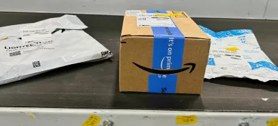 FILE PHOTO: Packages are transported on a conveyor belt at the Amazon warehouse, busy on Prime Day, in Melville, New York, U.S., July 11, 2023. REUTERS/Soren Larson/File Photo