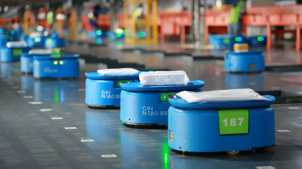 ﻿Robots operated by Alibaba's logistics unit Cainiao, move parcels at a new automated guided vehicles (AGV) warehouse inside the hub of delivery company YTO Express, in Hangzhou, Zhejiang province, China September 14, 2018. Picture taken September 14, 2018. REUTERS/Stringer ATTENTION EDITORS - THIS IMAGE WAS PROVIDED BY A THIRD PARTY. CHINA OUT.