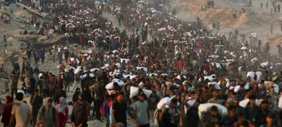 Palestinians gather to receive aid supplies in Beit Lahia, in the northern Gaza Strip, June 17, 2025. REUTERS/Stringer