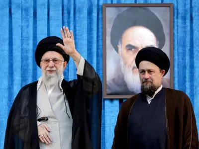FILE PHOTO: Ayatollah Ruhollah Khomeini's grandson, Hassan Khomeini stands next to Iran's Supreme Leader Ayatollah Ali Khamenei during the 36th anniversary of the death of the leader of Iran's 1979 Islamic Revolution, Ayatollah Ruhollah Khomeini, at Khomeini's shrine in southern Tehran, Iran June 4, 2025. Office of the Iranian Supreme Leader/WANA (West Asia News Agency)/Handout via REUTERS ATTENTION EDITORS - THIS PICTURE WAS PROVIDED BY A THIRD PARTY/File photo