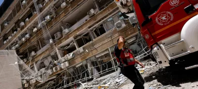 A rescuer walks at Soroka Medical Center, at an impact site following a missile strike from Iran on Israel, in Be'er Sheva, Israel June 19, 2025. REUTERS/Amir Cohen