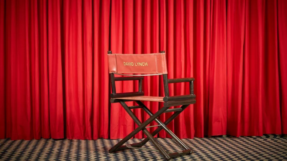 David Lynch's director's chair emblazoned with his name on the back ($5,000 - $7,000); his personally owned Twin Peaks Black Lodge style red curtain and black and white zig-zag rug ($1,000 - $2,000).   A treasure trove of over 450 personal artifacts from the late filmmaker David Lynch is to be auctioned. The event offers fans and collectors a rare opportunity to own pieces from the visionary director's five-decade career and personal life. The collection spans Lynch's legendary work in film and television—including Twin Peaks, Mulholland Drive, Eraserhead, The Elephant Man, and Blue Velvet—and features items from his home, studio, and woodshop.,Image: 1004881051, License: Rights-managed, Restrictions: Editorial use, commercial use may require additional licenses. We don't use AI to make images which could be mistaken for news photos. AI use will be clearly indicated. Supplied on condition you ensure personal data is processed in compliance with UK GDPR, Model Release: noFoto: Profimedia