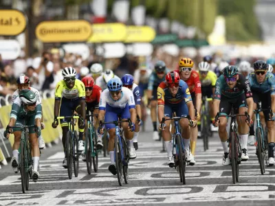 Cycling - Tour de France - Stage 21 - Saint-Quentin-En-Yvelines to Paris Champs-Elysees - France - July 23, 2023 Bora–Hansgrohe's Jordi Meeus crosses the finish line to win stage 21 alongside Alpecin–Deceuninck's Jasper Philipsen, Team Jayco–AlUla's Dylan Groenewegen and Lidl–Trek's Mads Pedersen REUTERS/Stephane Mahe