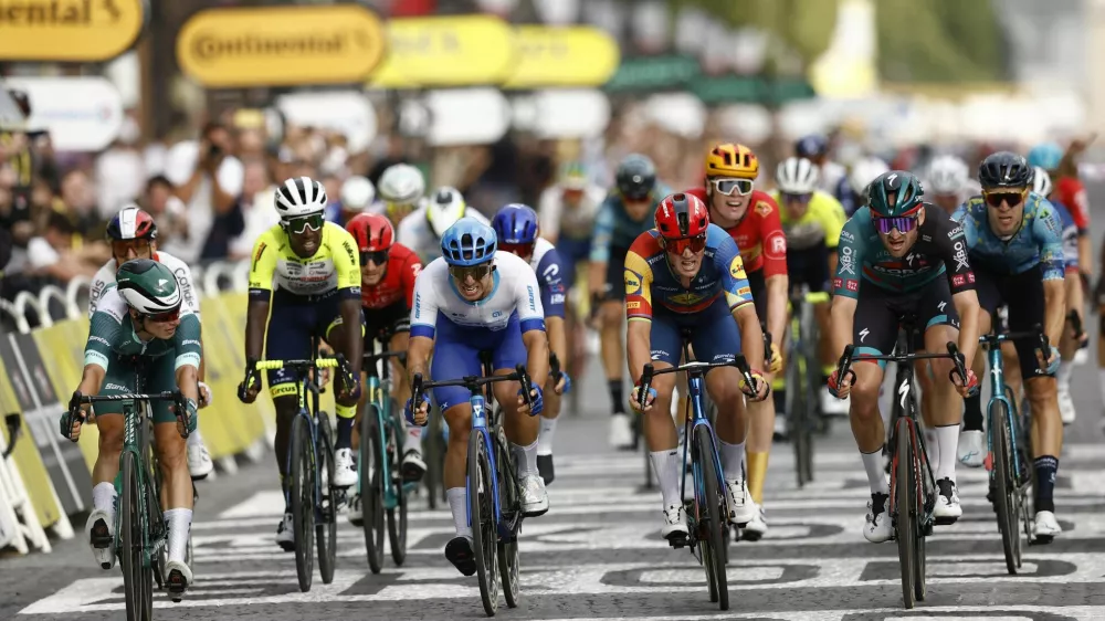 Cycling - Tour de France - Stage 21 - Saint-Quentin-En-Yvelines to Paris Champs-Elysees - France - July 23, 2023 Bora–Hansgrohe's Jordi Meeus crosses the finish line to win stage 21 alongside Alpecin–Deceuninck's Jasper Philipsen, Team Jayco–AlUla's Dylan Groenewegen and Lidl–Trek's Mads Pedersen REUTERS/Stephane Mahe