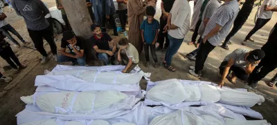 21 June 2025, Palestinian Territories, Gaza CityPalestinians mourn over the bodies of thosw who were killed in Israeli attacks, outside the morgue of Al-Shifa Hospital in Gaza City. PhotoOmar Ashtawy/APA Images via ZUMA Press Wire/dpa