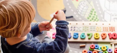 Baby toddler early development. Wooden stack and count rainbow colored learning game. Child learn colors and numbers