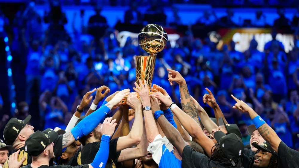 Jun 22, 2025; Oklahoma City, Oklahoma, USA; The Oklahoma City Thunder lift the Larry O'Brien Championship Trophy as they celebrate after winning game seven of the 2025 NBA Finals against the Indiana Pacers at Paycom Center. Mandatory Credit: Kyle Terada-Imagn Images